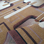 Détail des motifs géométriques et bord retourné du tapis Menton