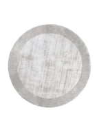 Tapis rond Sienne gris argenté, centre effet délavé et bordure unie, vue de dessus