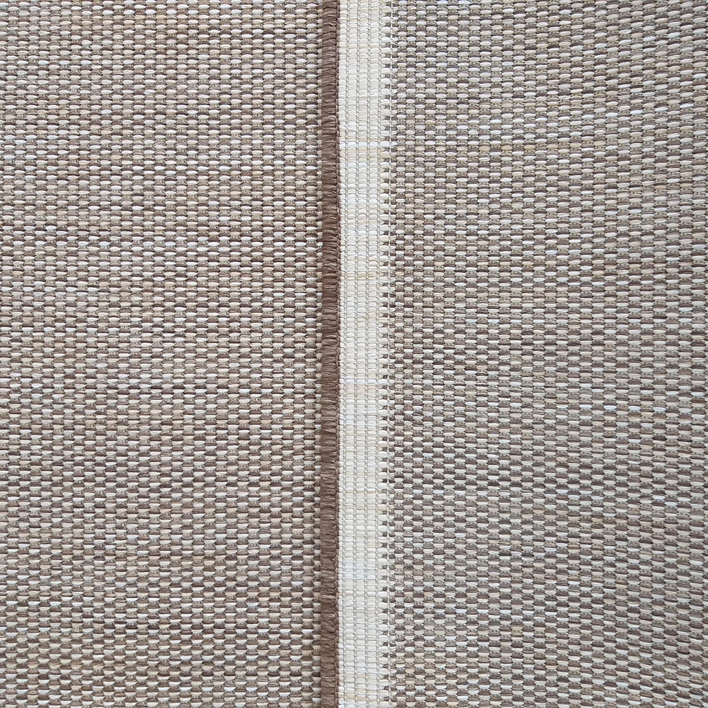 Détail de la bordure et du tissage du tapis Cassis